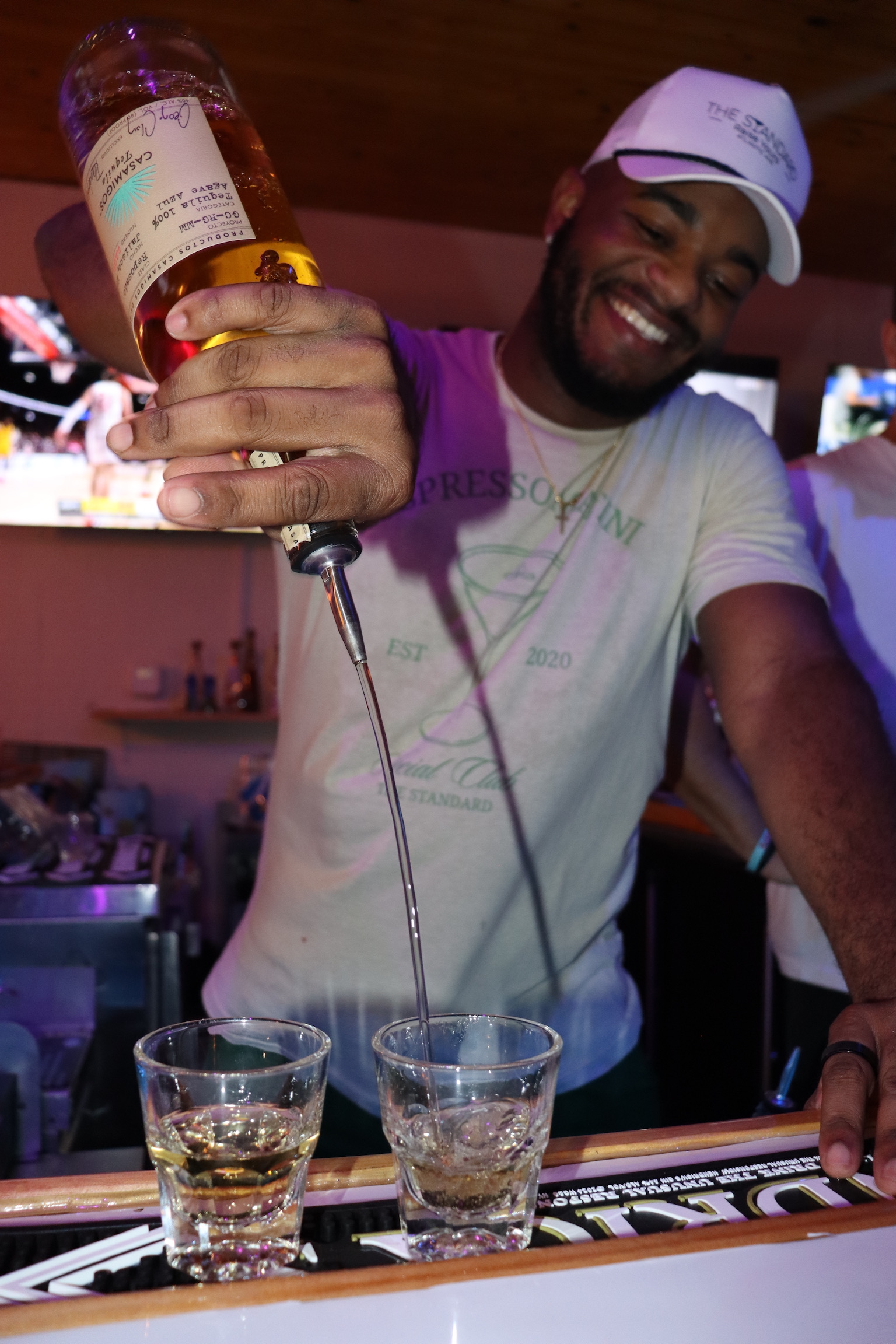 Bartender pouring cocktails at The Standard Delray Beach